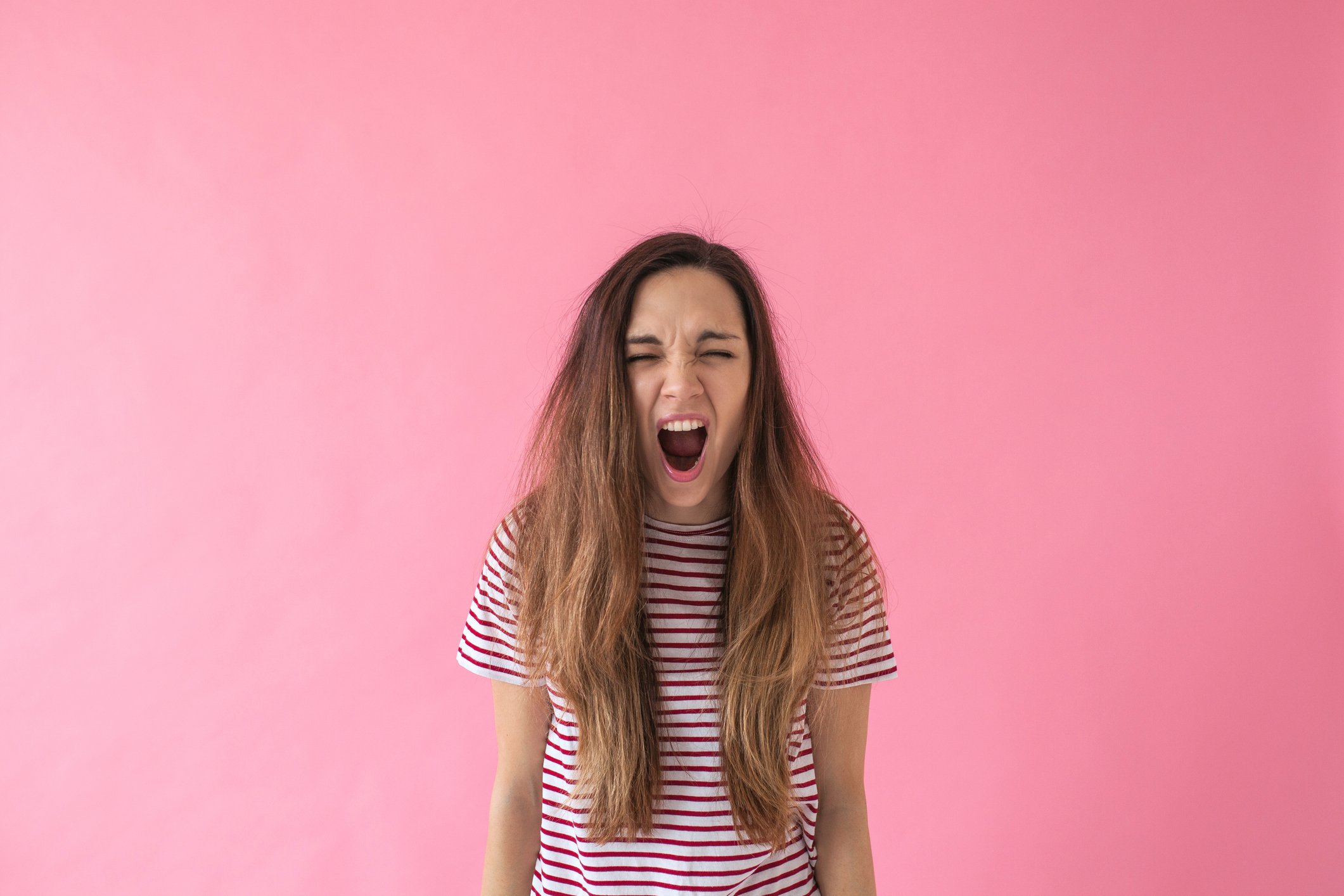 A girl screams or expresses emotions