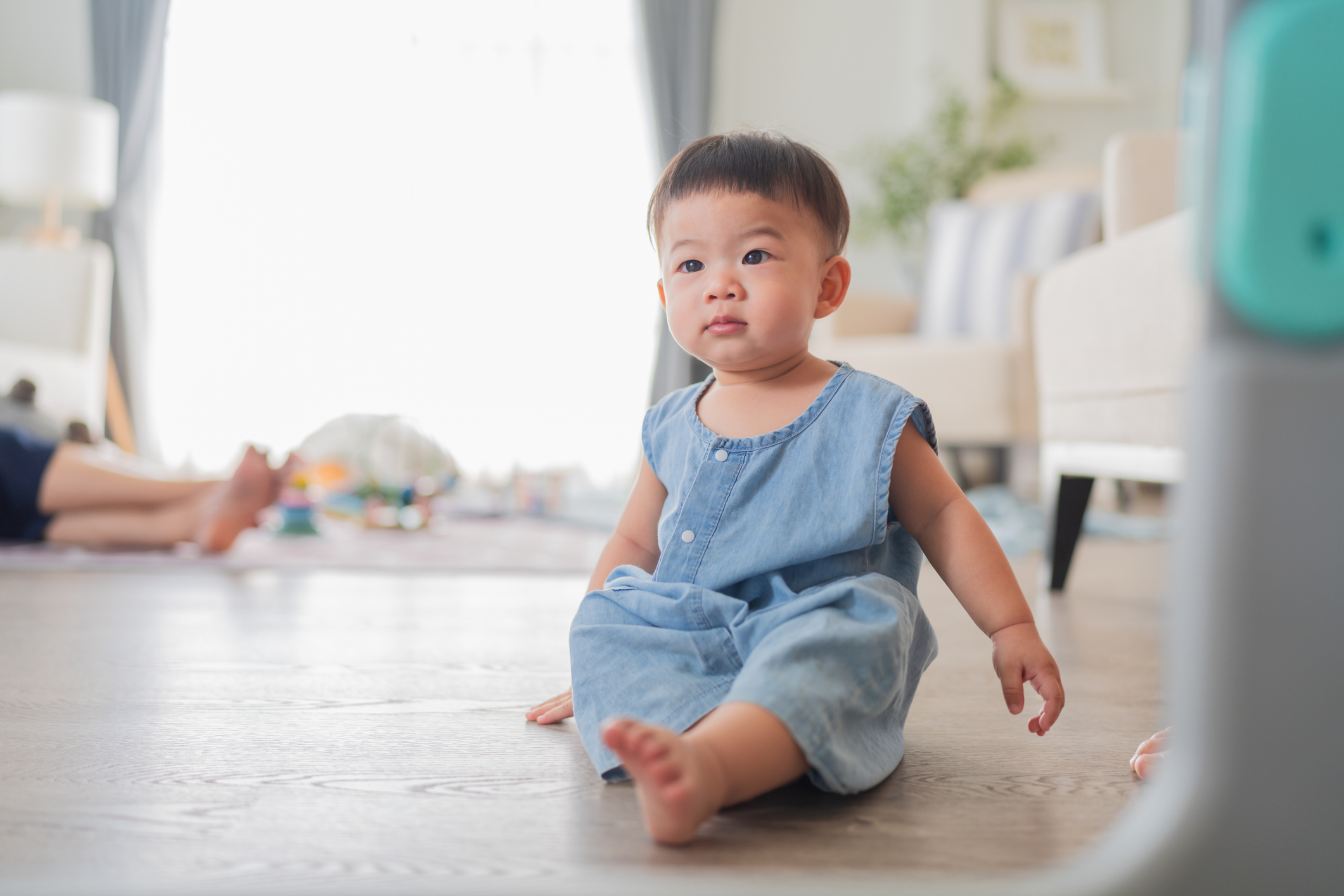 cute happiness cheerful asian baby boy 7-12 month learn to crawl and moving around the floor smiling joyful playful at home
