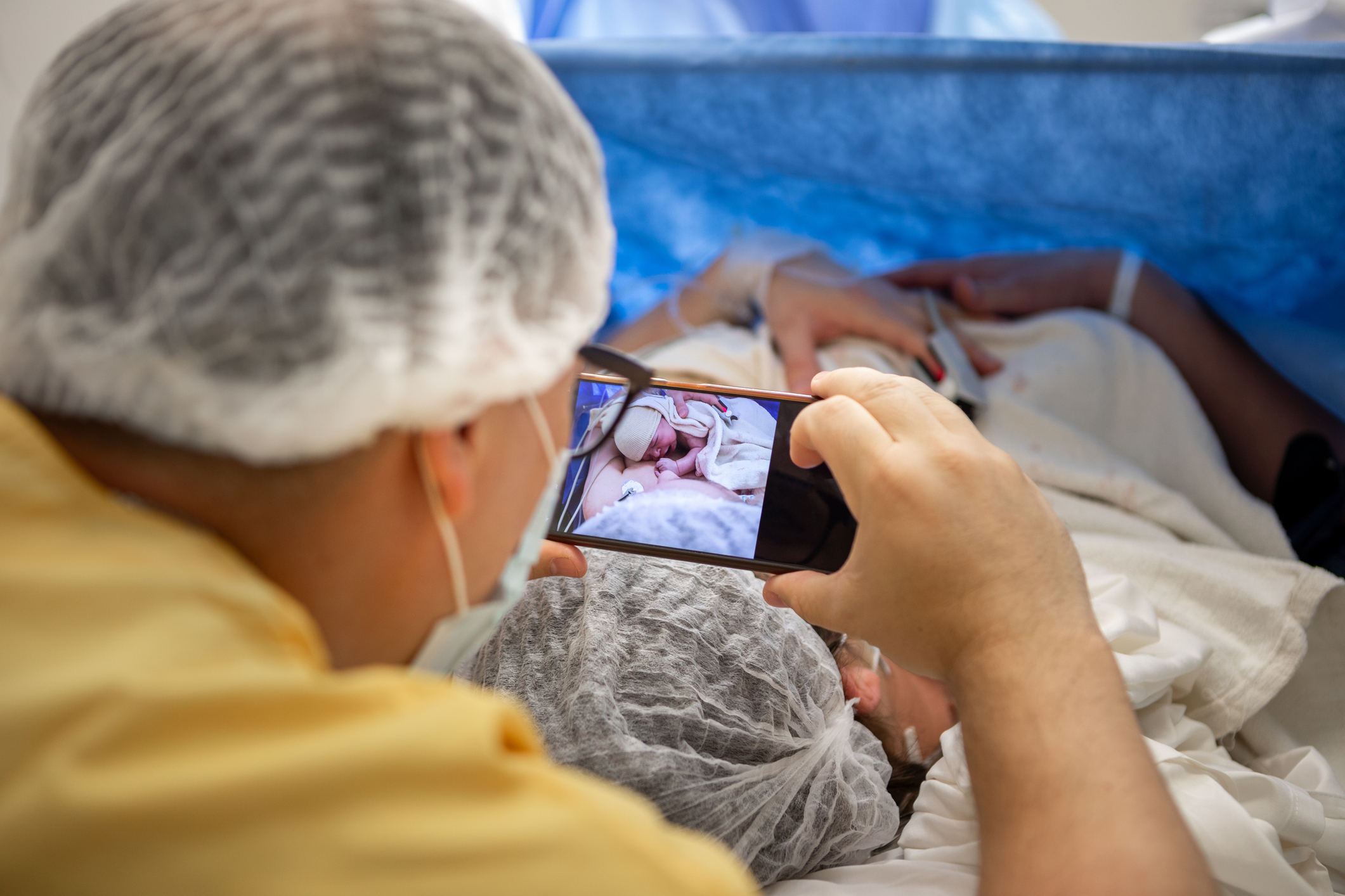 Mother and newborn daughter by cesarean section - Doctors performing a cesarean section in the operating room - Buenos Aires - Argentina