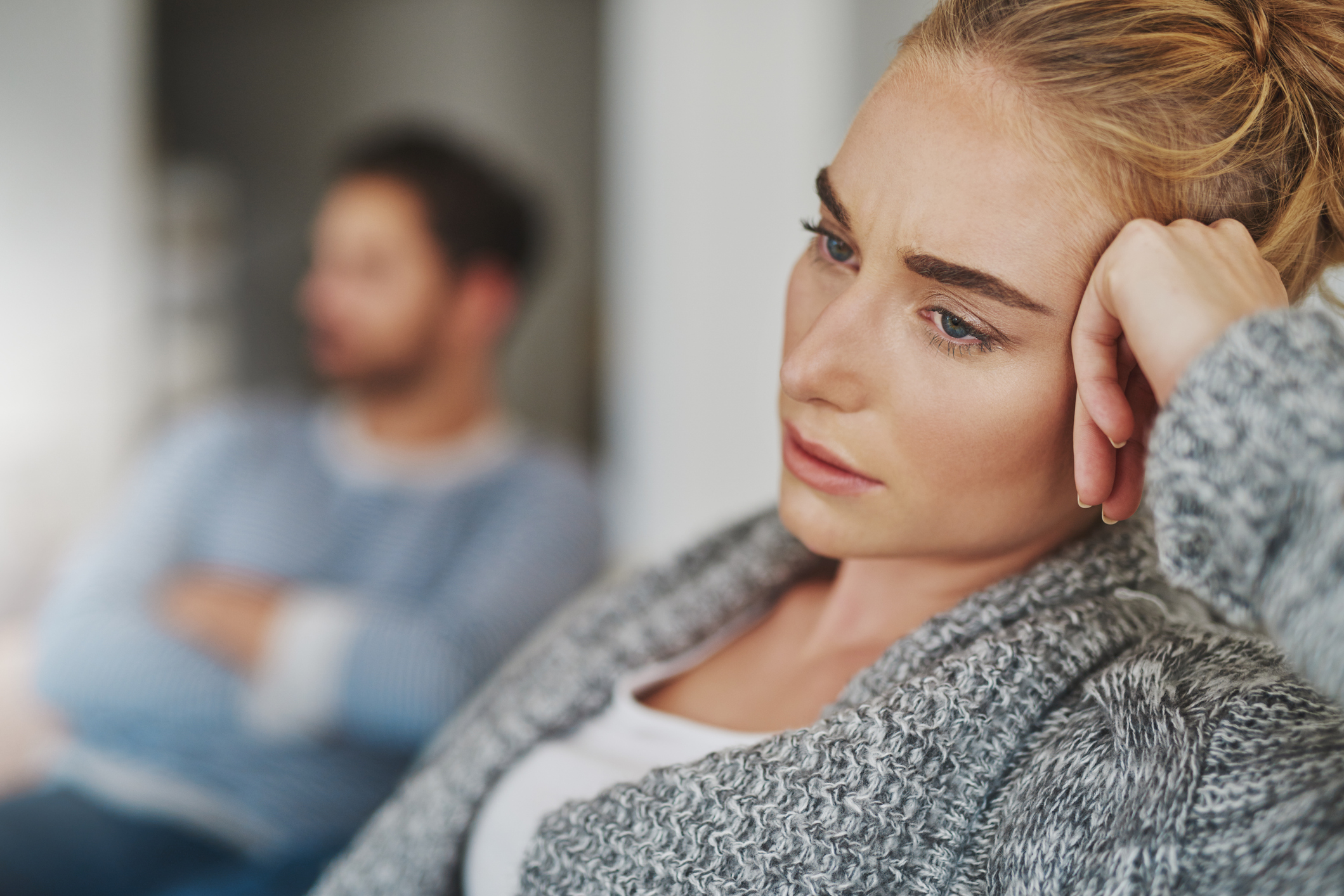 Cropped shot of an unhappy young couple after a fight at home