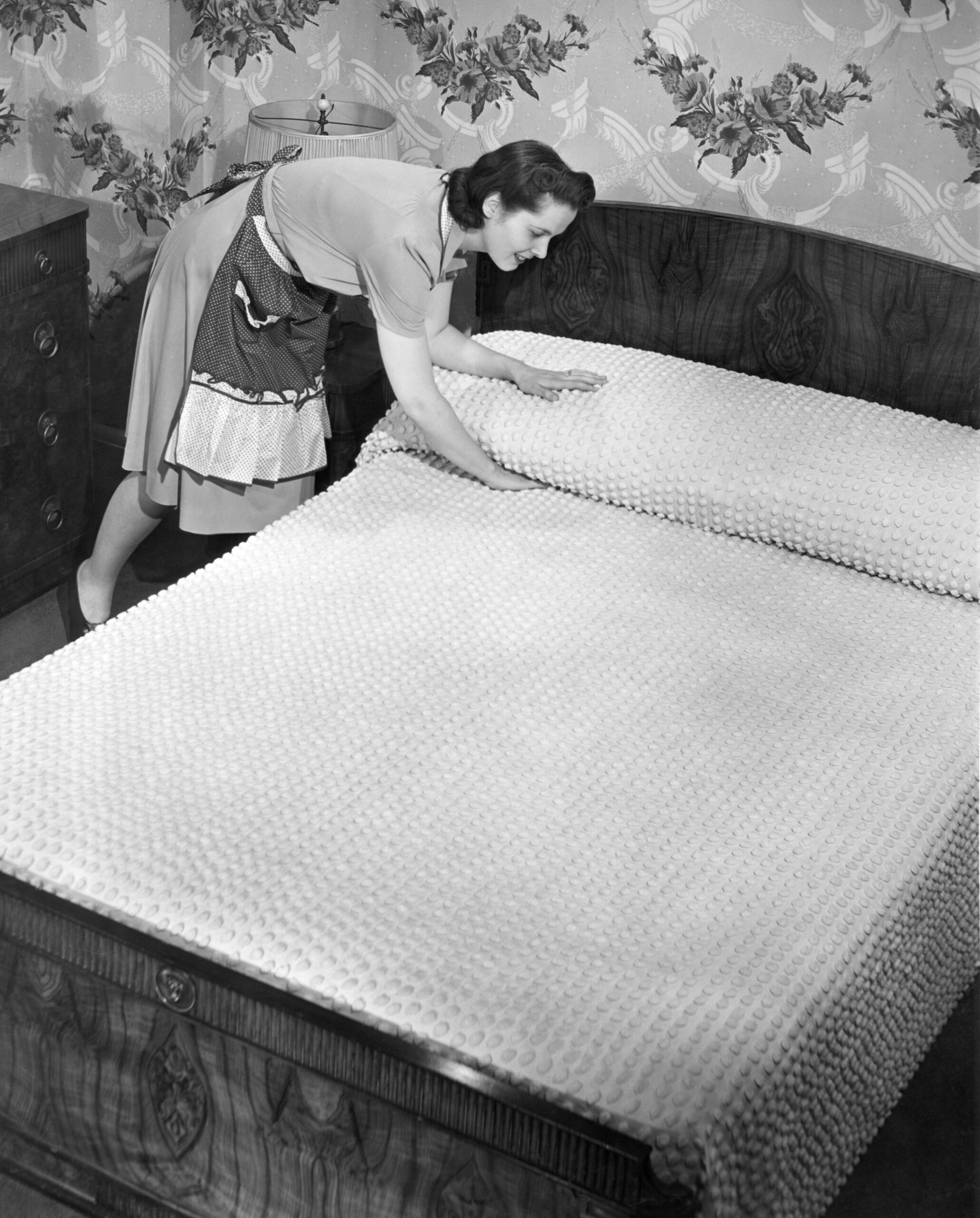 Housewife making bed
