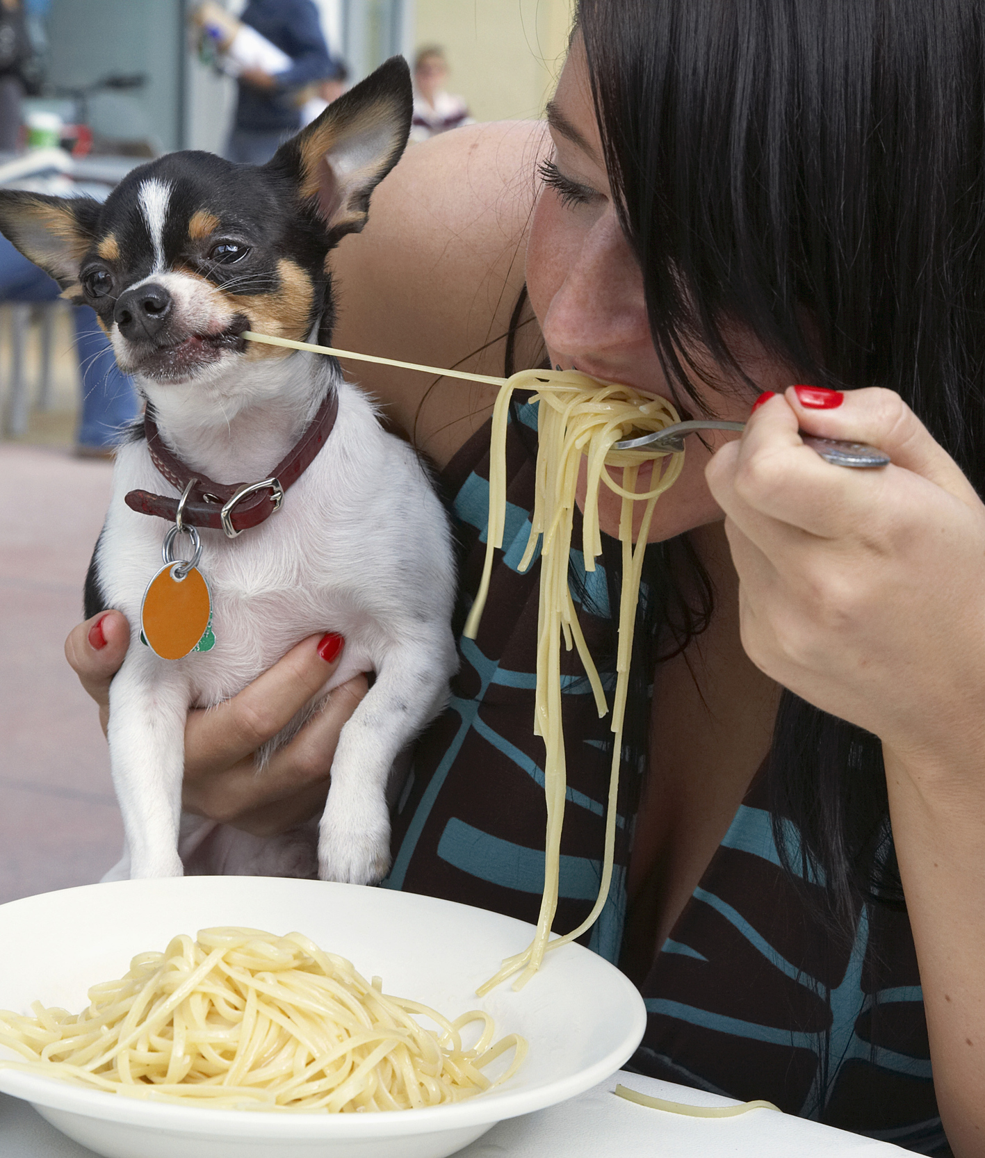 124002-woman-and-dog-sharing-pasta-2.jpg