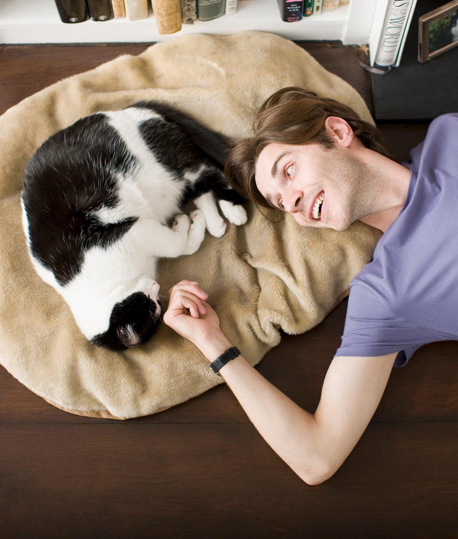 124051-man-laying-on-floor-with-cat-2.jpg