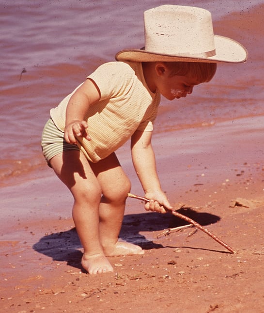 131034-toddler-stick-beach.jpg