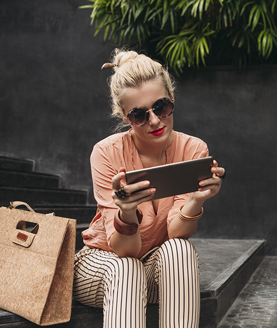 134003-8-stylish-woman-looking-at-tablet.jpg