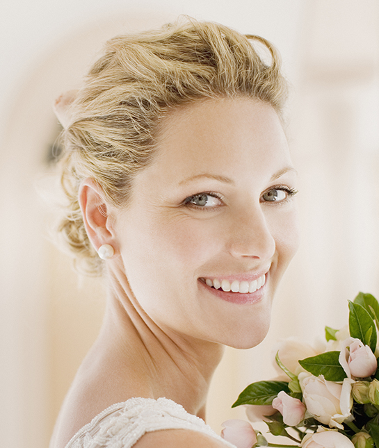 Smiling bride with bouquet