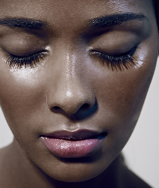 close up of black females face with closed eyes close up of black females face with closed eyes