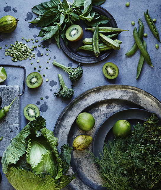 High angle view of green fruits and vegetables on plates