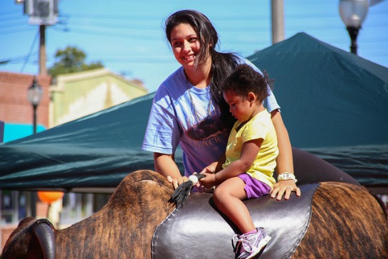 150408-mom-with-baby-mechanical-bull-resized.jpg