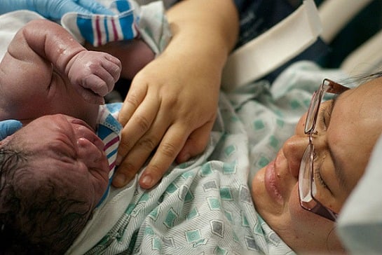 150612-asian-woman-looking-at-baby-on-chest-resized.jpg