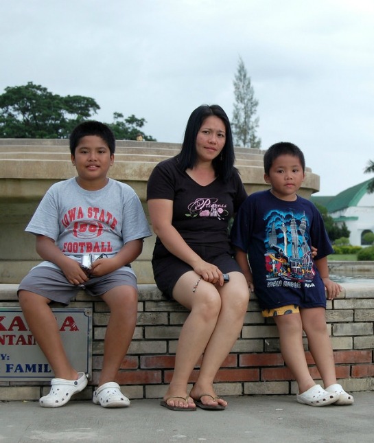 152180-mom-and-2-kids-by-fountain-cancer.jpg