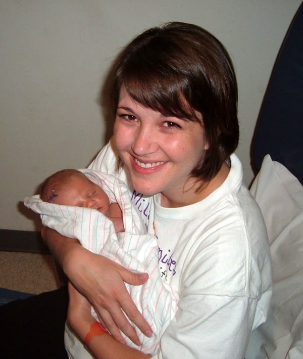 153792-mom-white-shirt-holding-newborn-resized.jpg