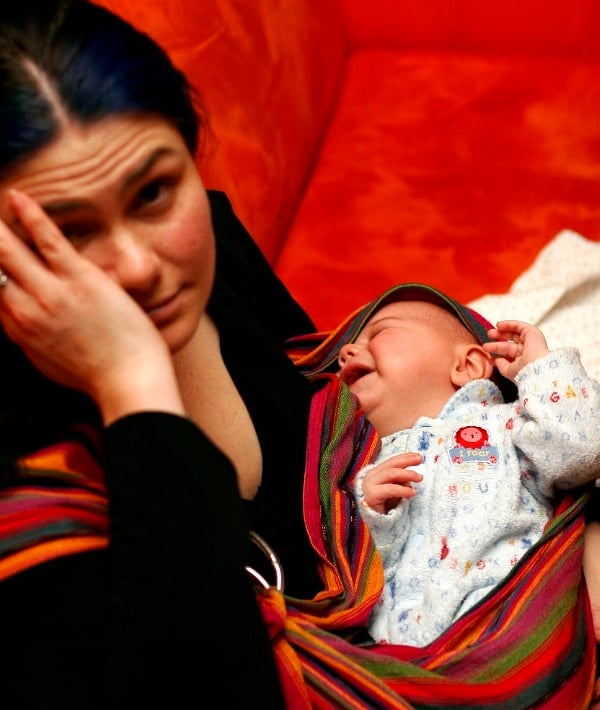 154891-black-hair-mom-tired-holing-baby-red-couch2resized.jpg