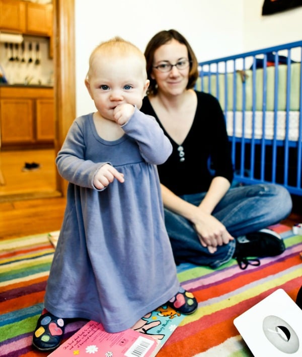 154900-mom-sitting-behind-standing-baby-resized.jpg