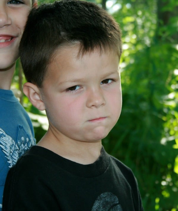 155613-boy-black-shirt-mean-face-resized.jpg
