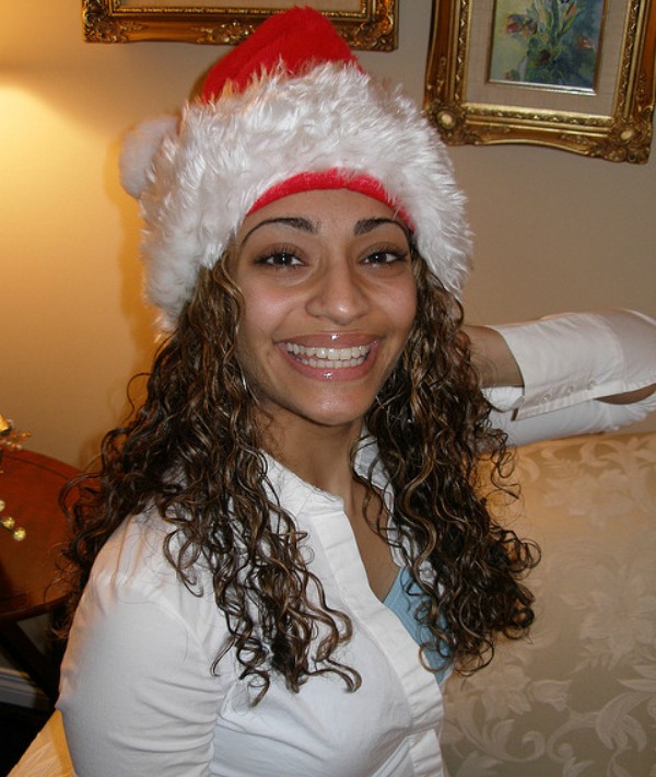 158046-curly-haired-santa-hat-big-smiles.jpg