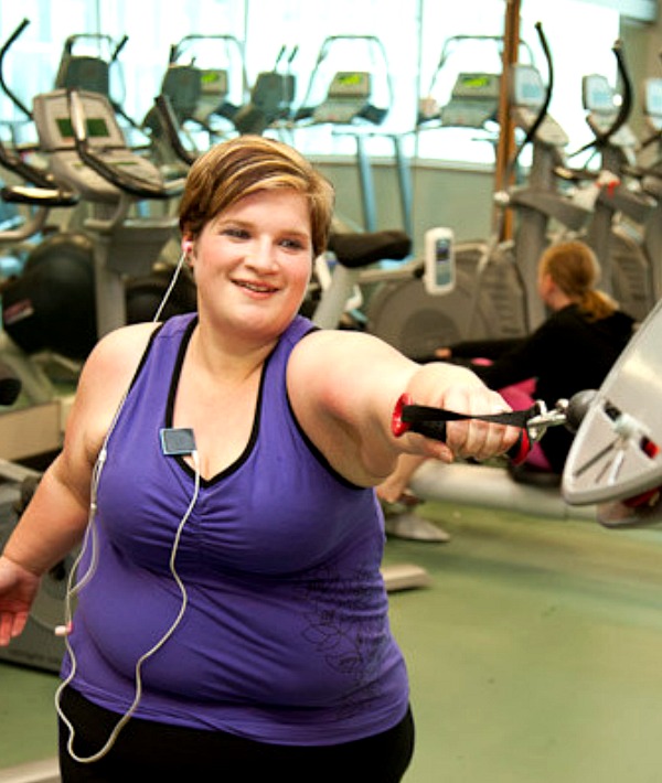 158533-woman-purple-shirt-working-out-with-machine.jpg