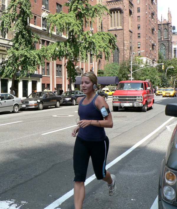 158537-woman-running-through-city-dark-blue-top.jpg