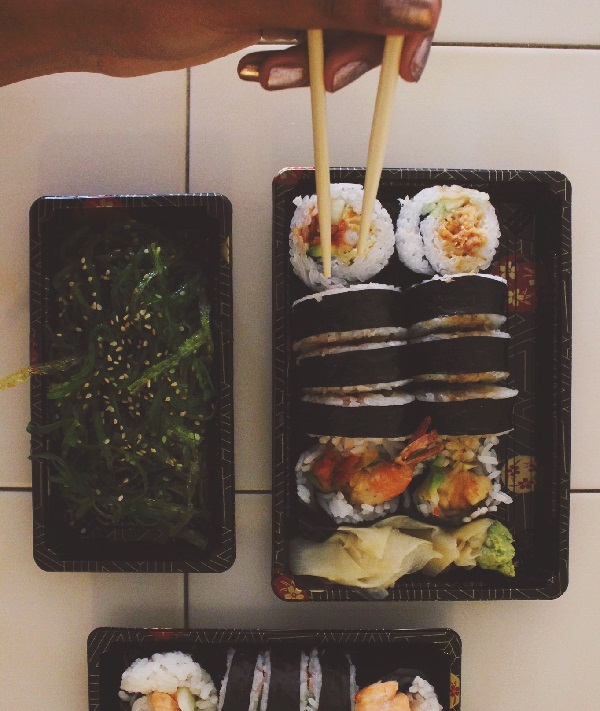 161308-woman-eating-sushi-takeout.jpg