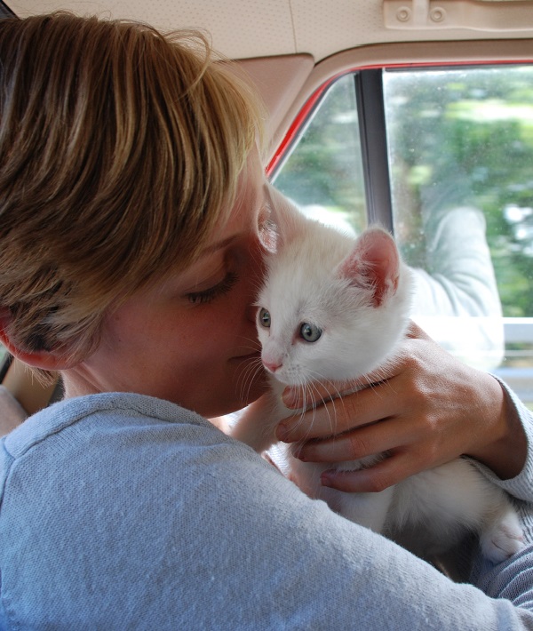161328-woman-cuddling-kitten.jpg