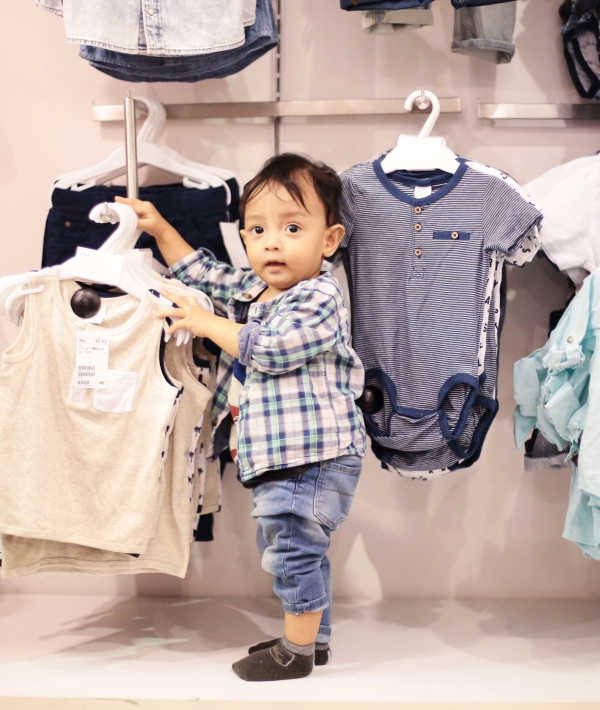 161991-kid-holding-clothes-shopping.jpg