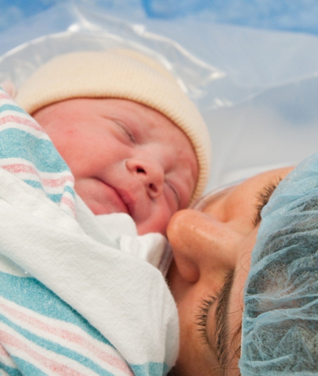 162961-mom-kissing-newborn.jpg