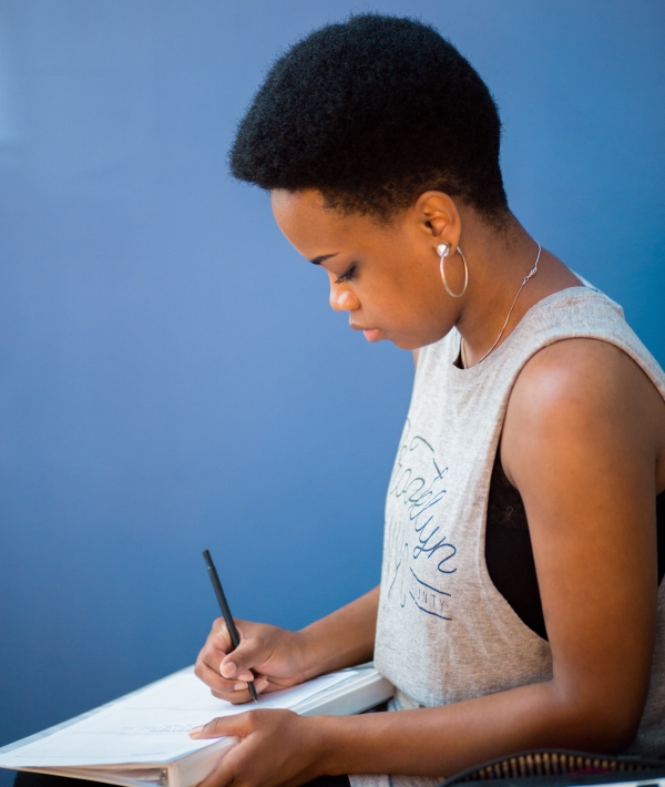 163251-woman-writing-reflecting.jpg