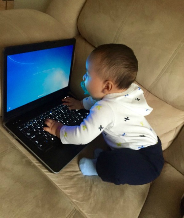 166502-baby-on-computer-sagittarius.jpg