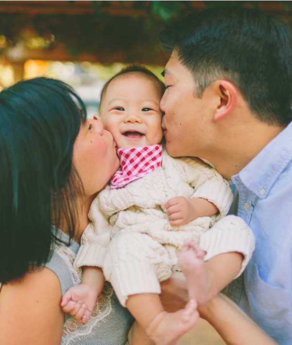 167254-couple-kissing-baby.jpg