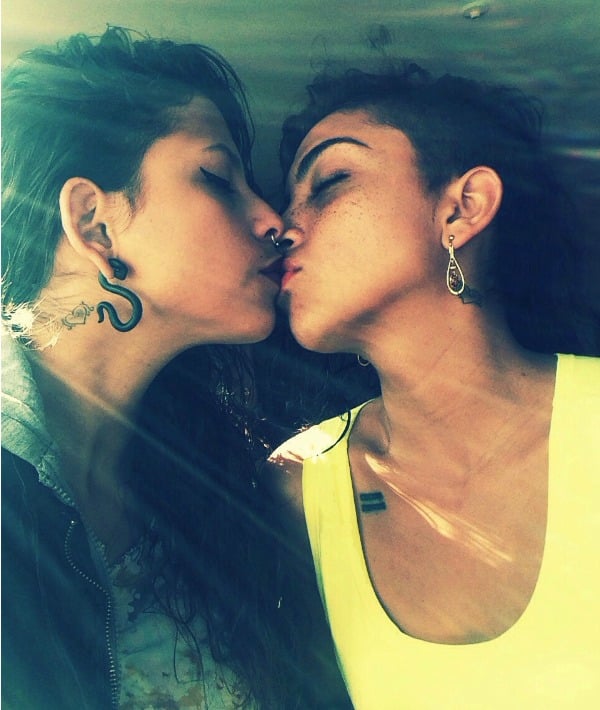 169182-couple-kissing-black-jacket-and-yellow-tank-top.jpg