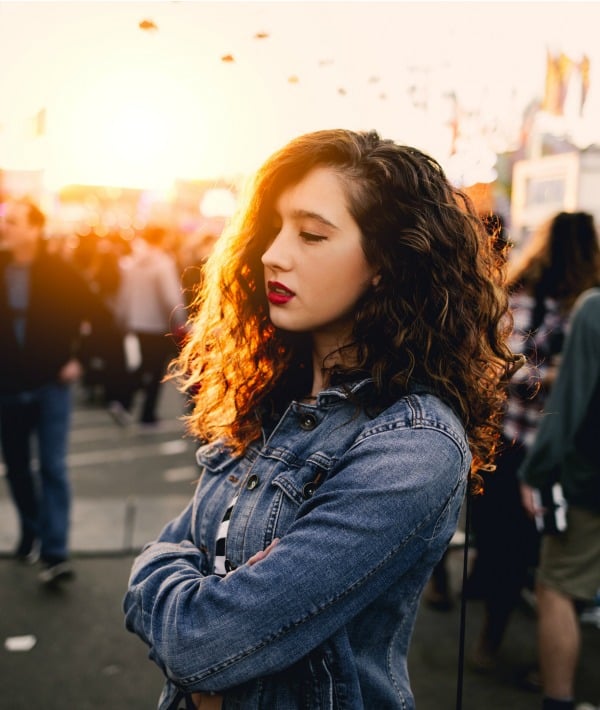 169458-woman-in-jean-jacket-with-arms-crossed.jpg