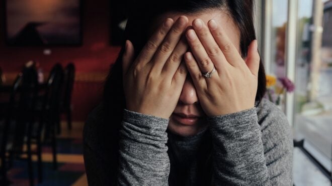 woman-covering-face