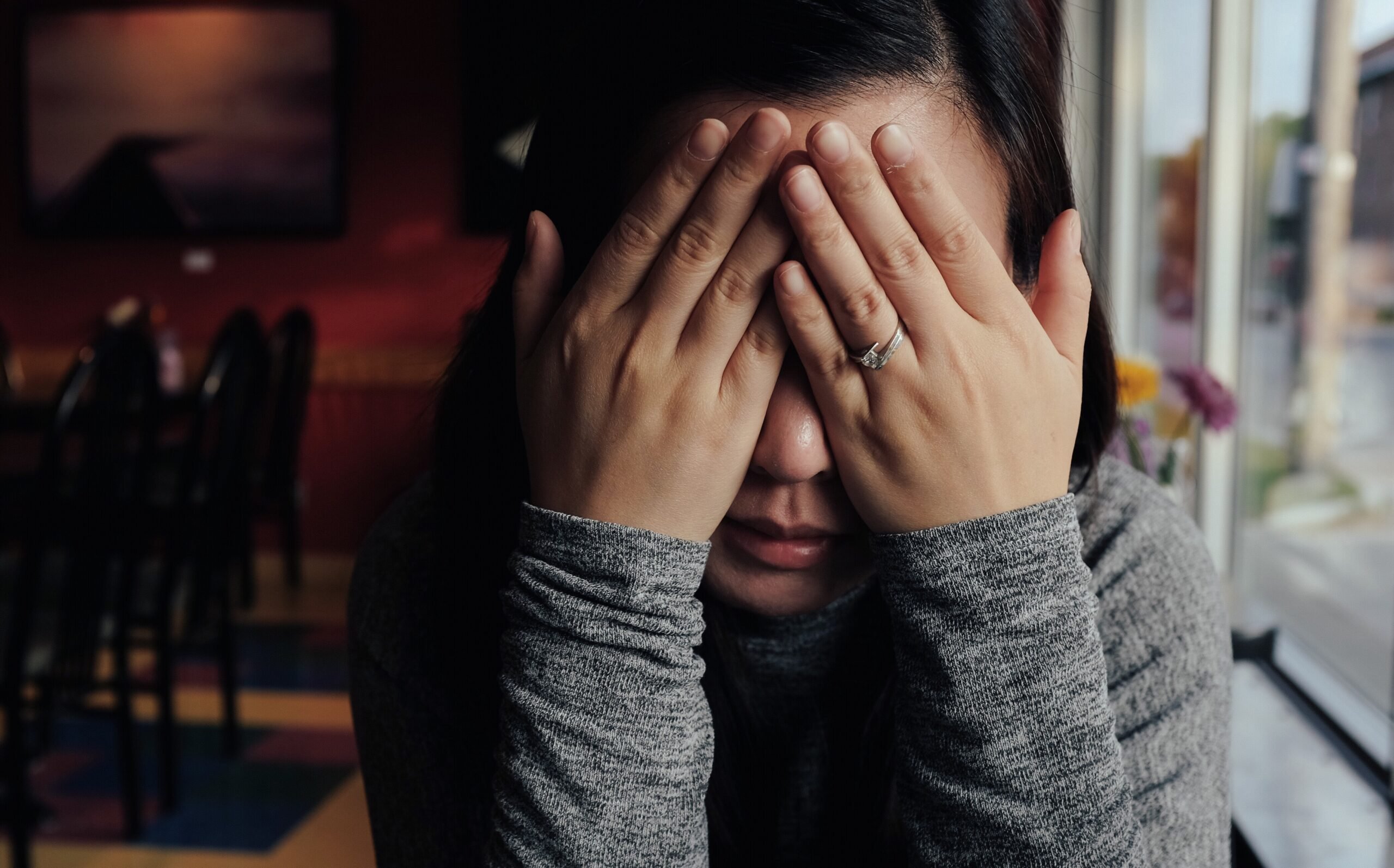 woman-covering-face