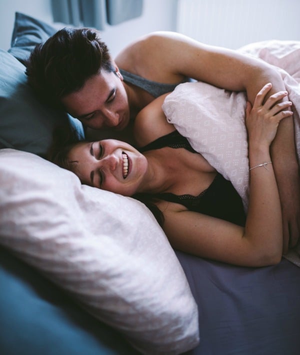 170824-couple-bed-woman-laugh.jpg