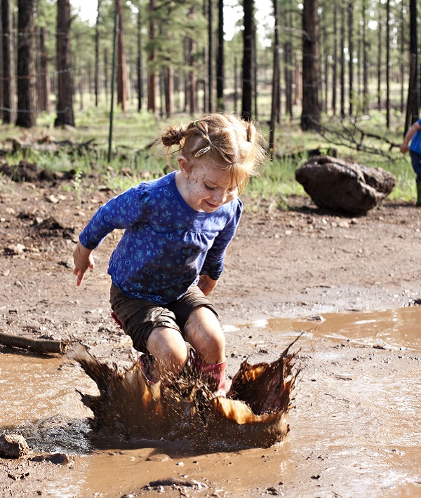 171281-girl-jumping-mud.jpg