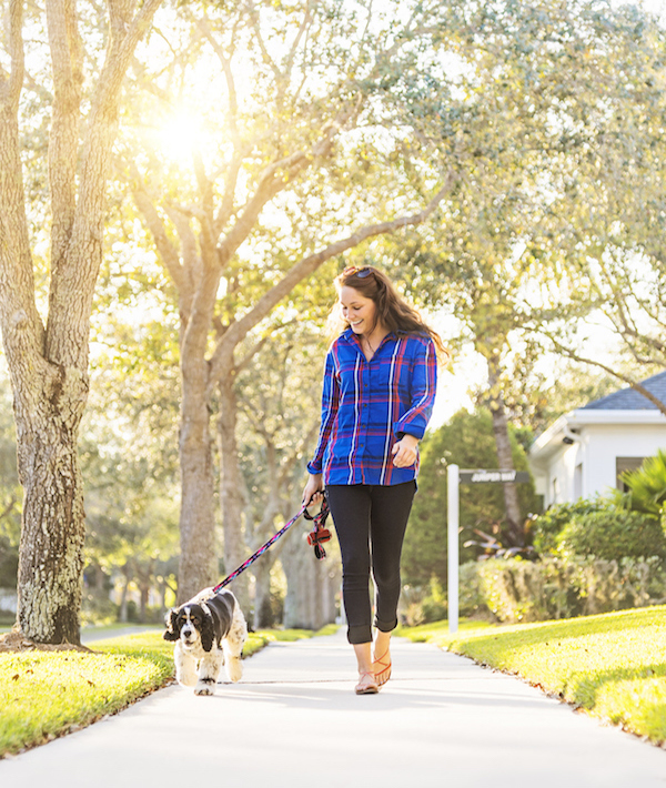 USA, Florida, Jupiter, Woman walking her dog