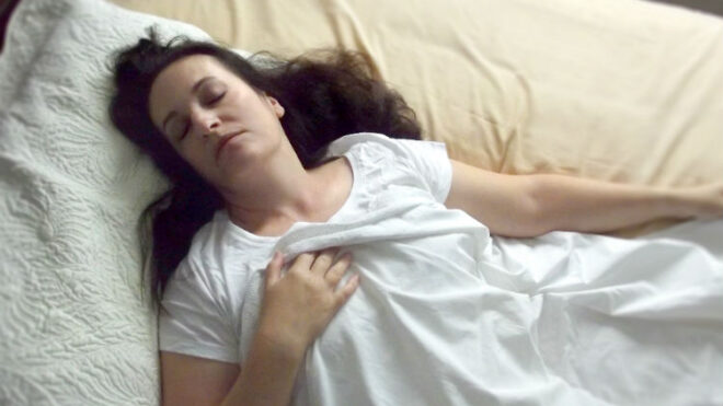 woman-laying-bed-tired