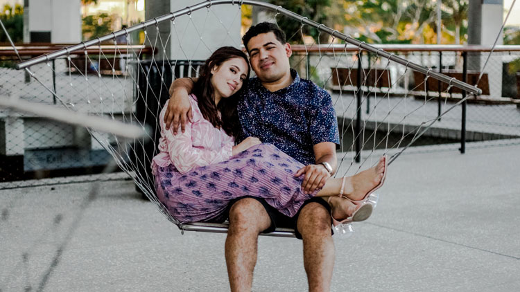 couple-sitting-swing