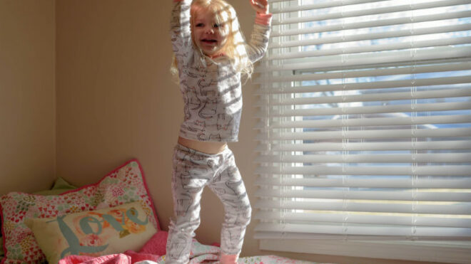 girl-jumping-bed
