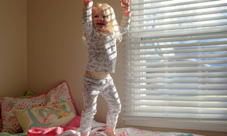 girl-jumping-bed