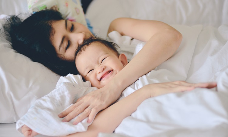baby-cuddled-mom