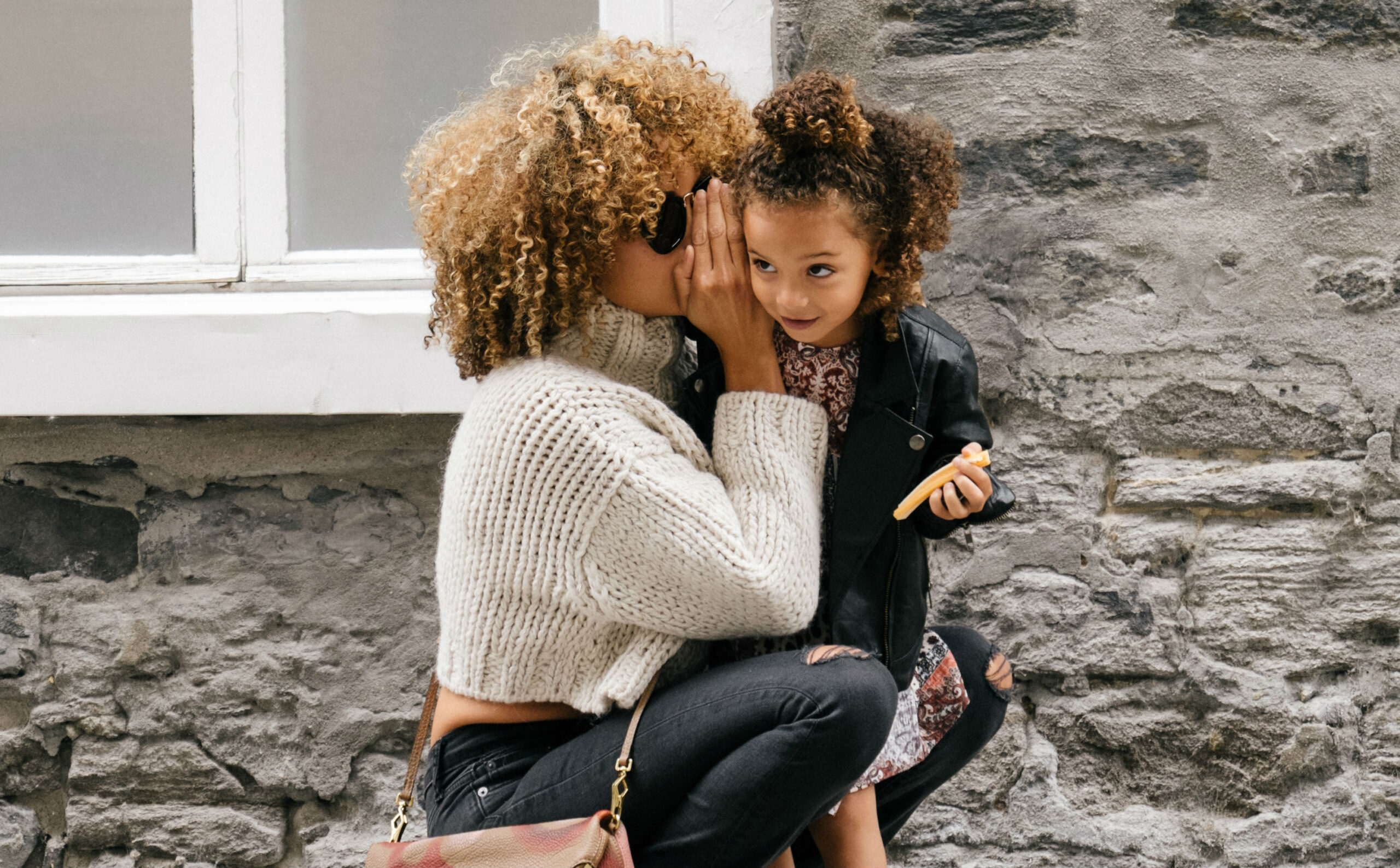 mom-whispering-daughter