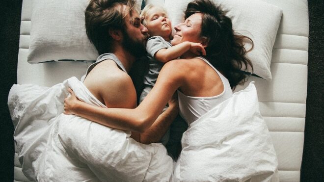 family-child-sleeping-bed-morning