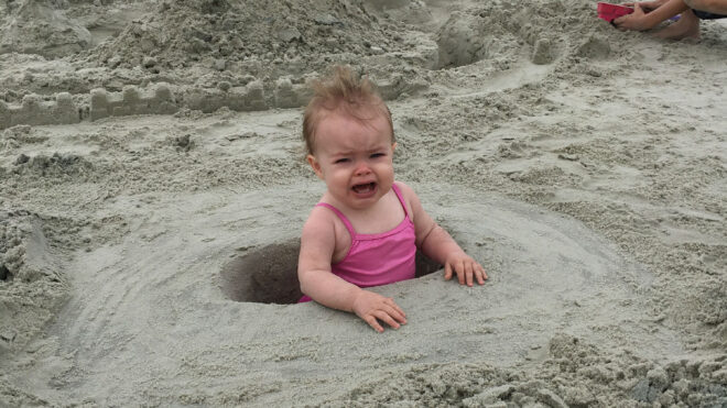 baby-crying-sand
