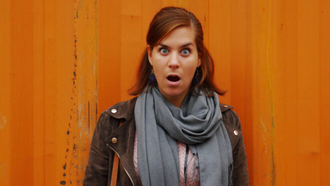 surprised-model-in-front-of-monochrome-background_t20_pqaq9r