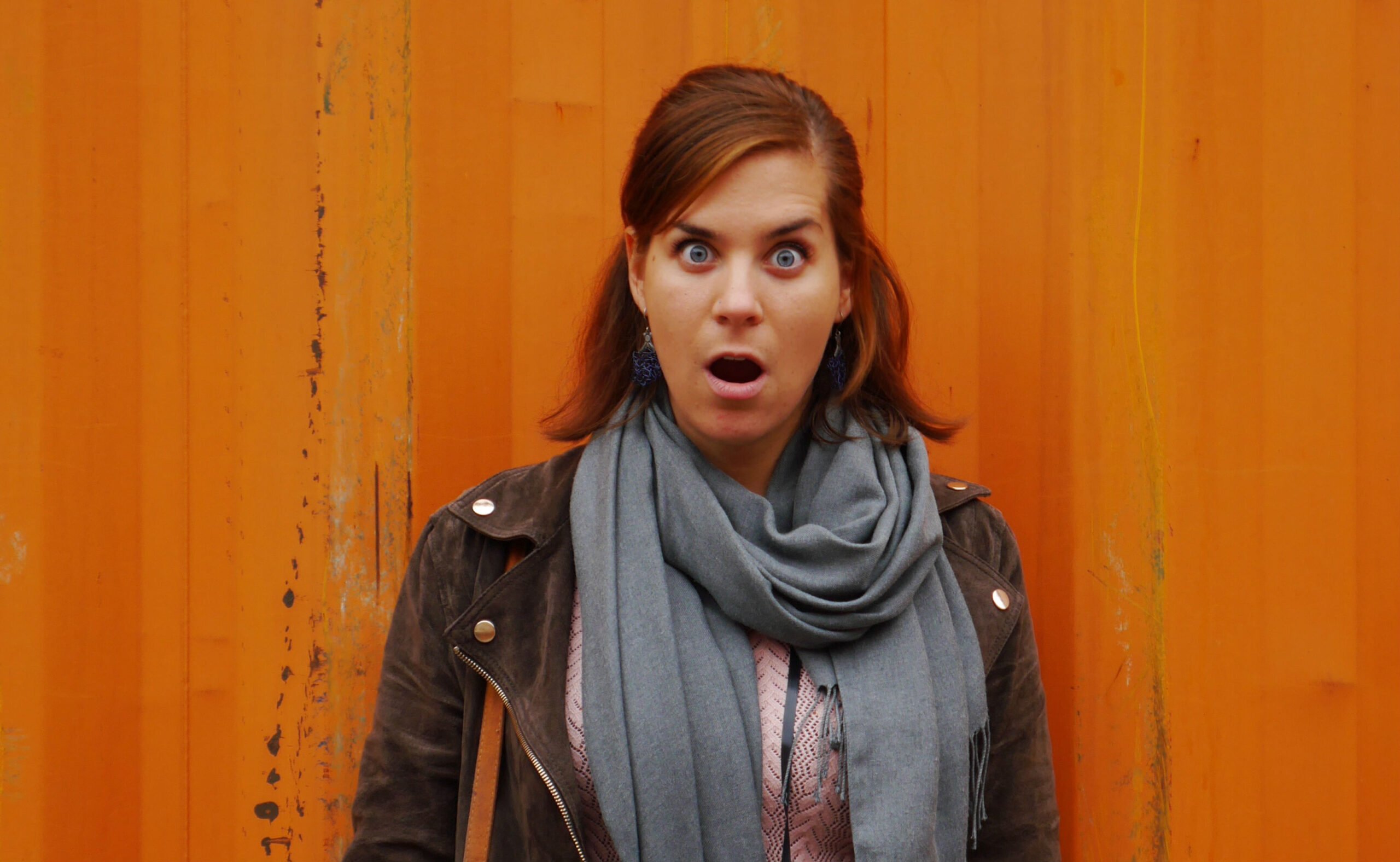 surprised-model-in-front-of-monochrome-background_t20_pqaq9r
