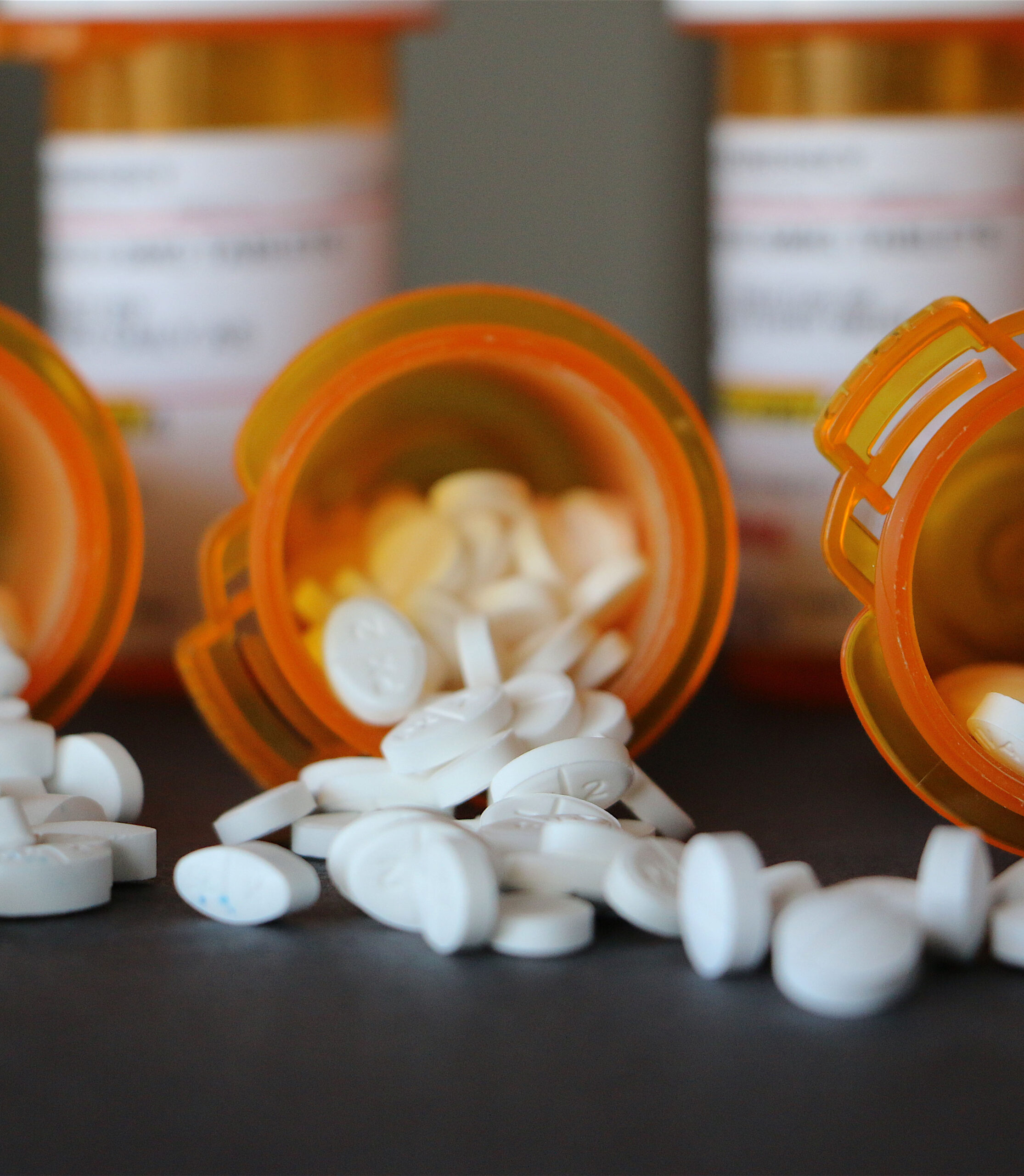 227619-abstract-image-of-medication-bottles-on-their-sides-with.jpg