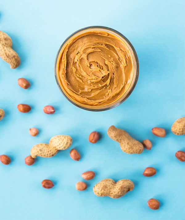 Close-Up Of Peanut Butter In Glass On Table