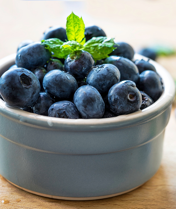Close-Up Of Fresh Blueberries In Bowl On Table