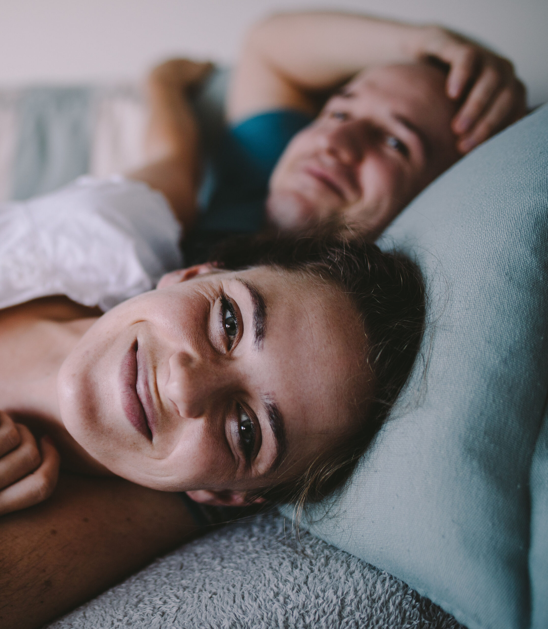 230505-adult-couple-sofa-smile-together-happy-couch-cuddle-relat.jpg